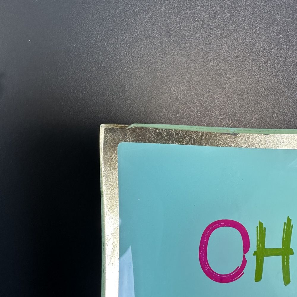 Glasbild, Wandbild, türkise Fläche, silberner Rand, bunter Schriftzug