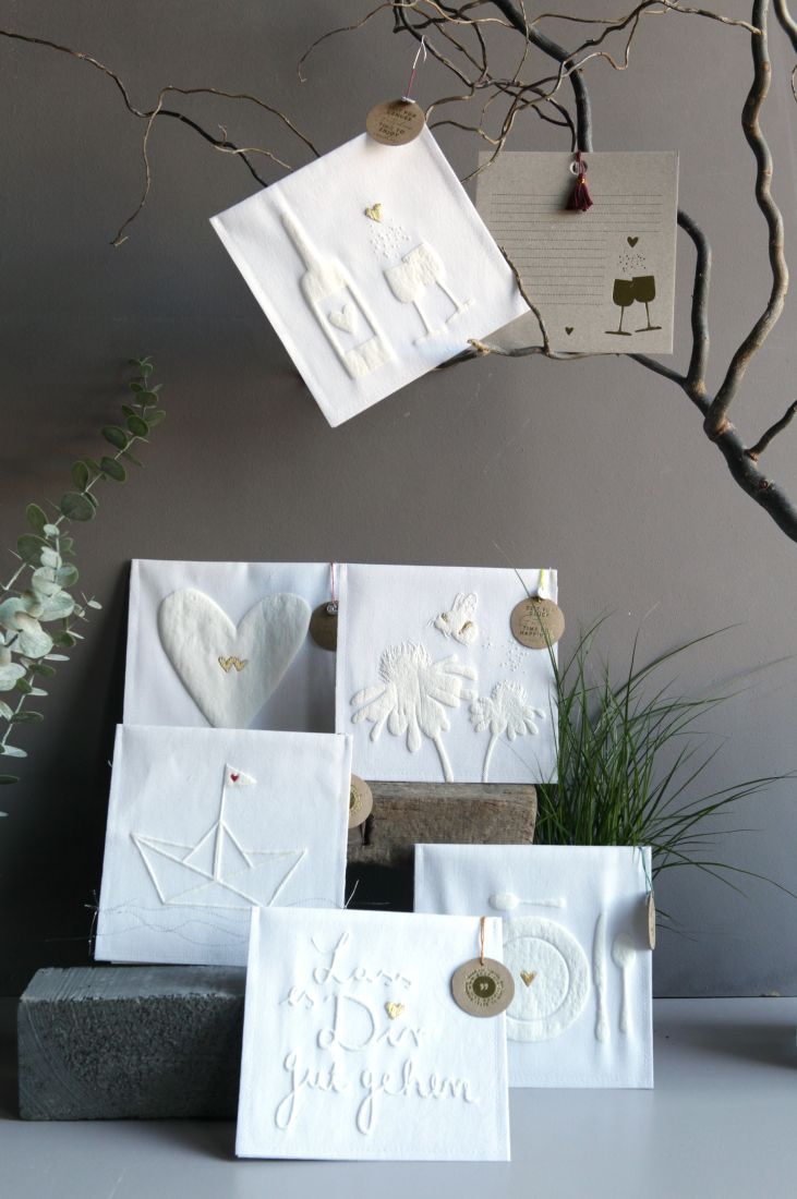 Zeitgeschenkgutschein mit weißer Stofftasche und beiliegender Karte